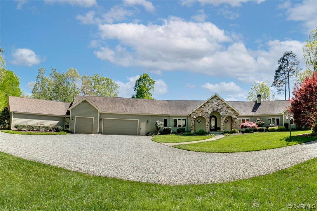 3535 Meadow Road Sandston, VA 23150 - Photo 50 of 50 a front view of a house with a garden and outdoor seating