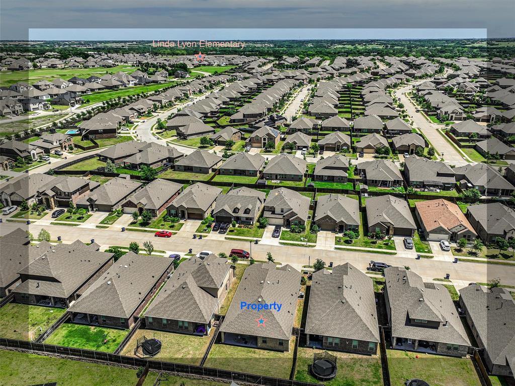 3024 Meredith Lane Forney, TX 75126 - Photo 24 of 29 Aerial perspective showcasing a residential development with numerous single-story homes