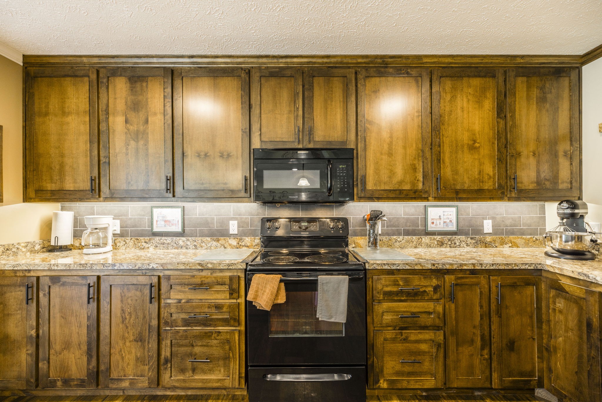 4265 Armstrong Road Springfield, TN 37172 - Photo 26 of 57 a kitchen with stainless steel appliances granite countertop a stove a sink and a microwave