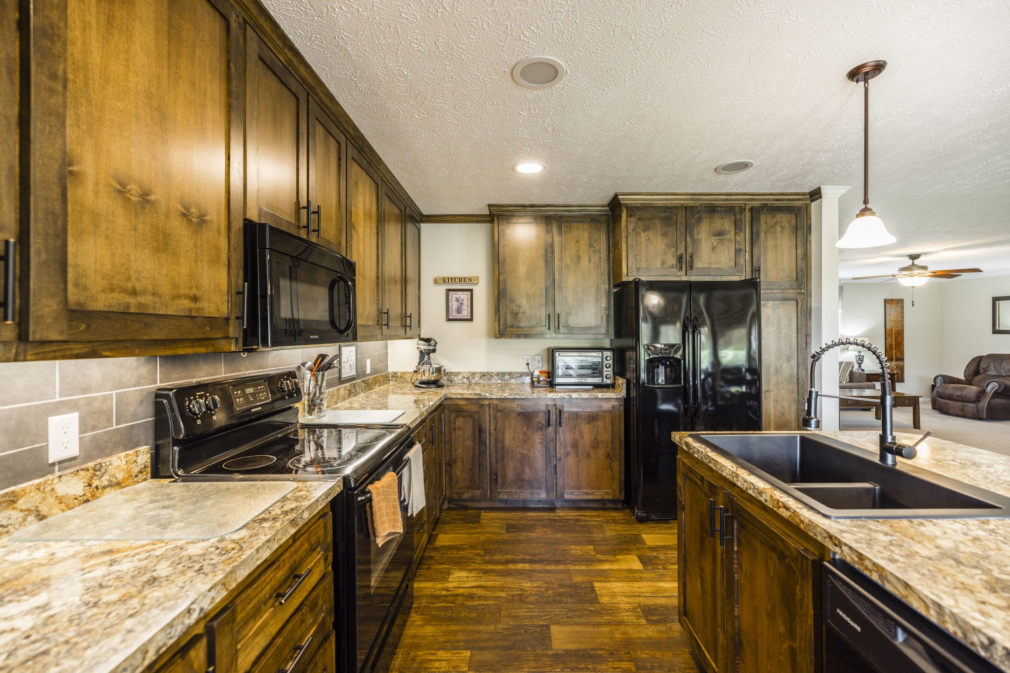 4265 Armstrong Road Springfield, TN 37172 - Photo 28 of 57 a kitchen with stainless steel appliances granite countertop sink stove top oven and refrigerator