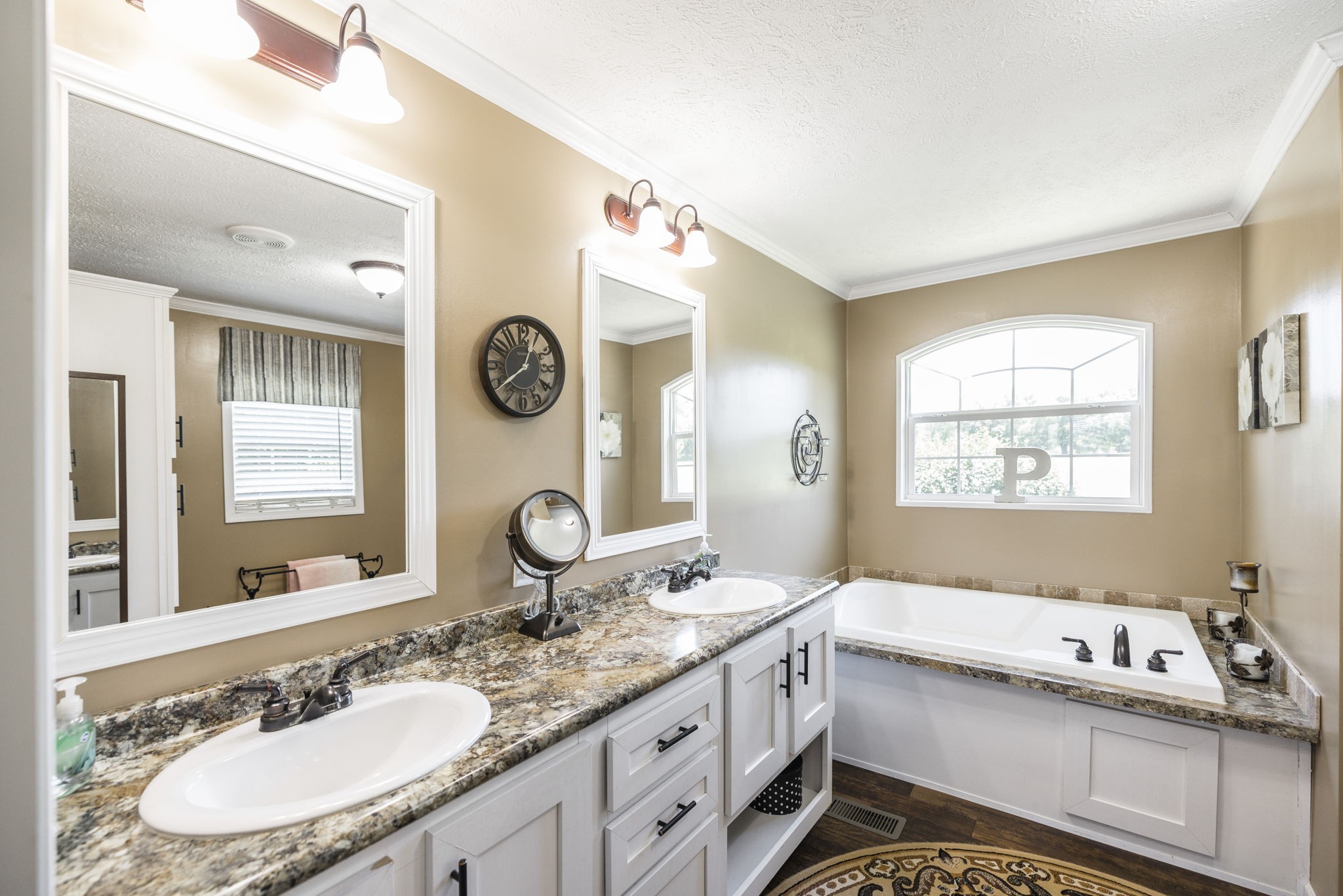 4265 Armstrong Road Springfield, TN 37172 - Photo 31 of 57 a bathroom with a granite countertop sink mirror and a bathtub with a window