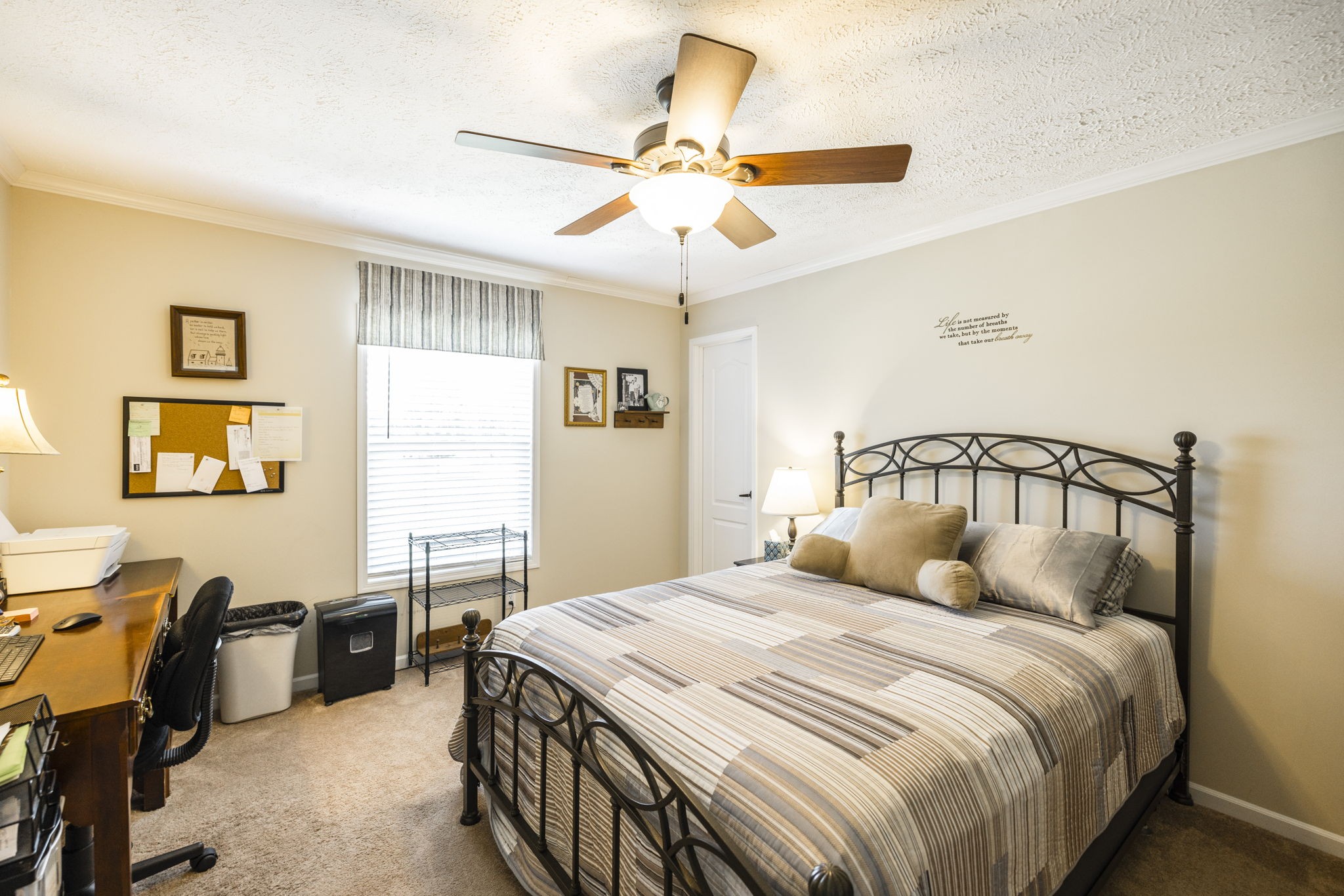 4265 Armstrong Road Springfield, TN 37172 - Photo 35 of 57 a bedroom with a bed and a chandelier