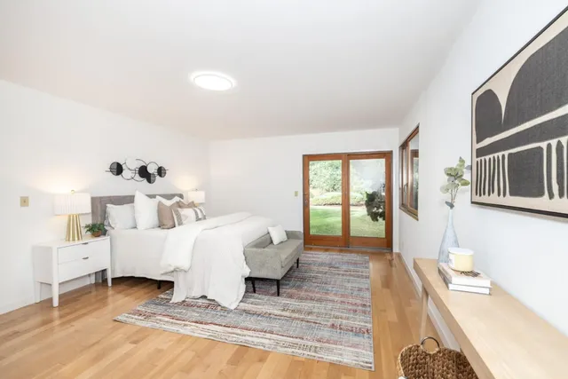 a bed room with furniture and a window