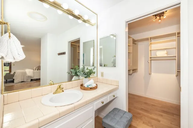 a bathroom with a sink and a mirror