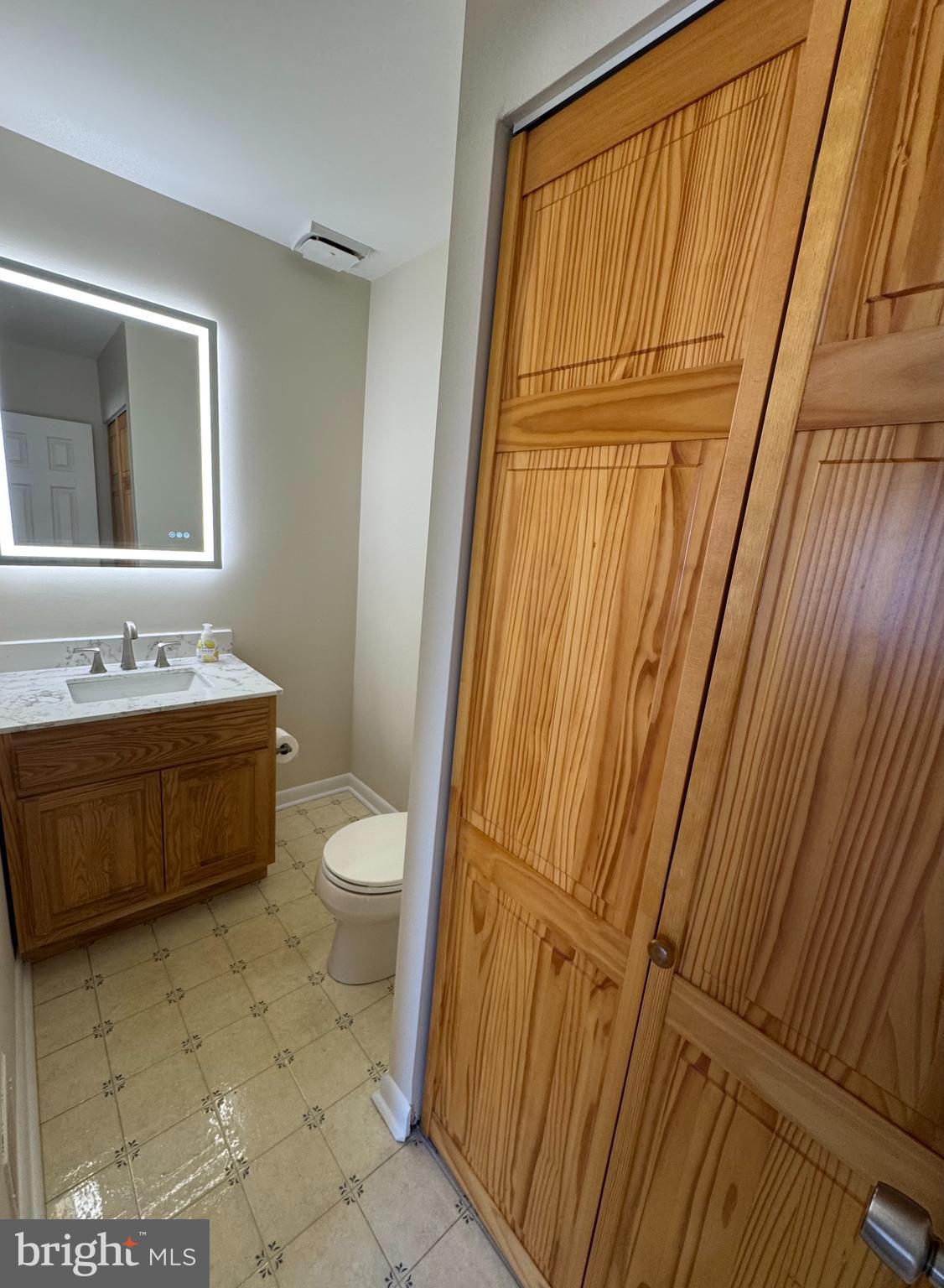 22 Fitzwatertown Road, Unit C12 Willow Grove, PA 19090 - Photo 14 of 24 Half bath w/ large storage closet w/ shelving