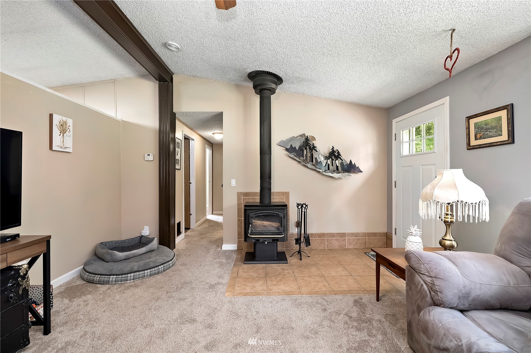16820 Littlerock Road Southwest Rochester, WA 98579 - Photo 14 of 33 a living room with furniture and a chandelier