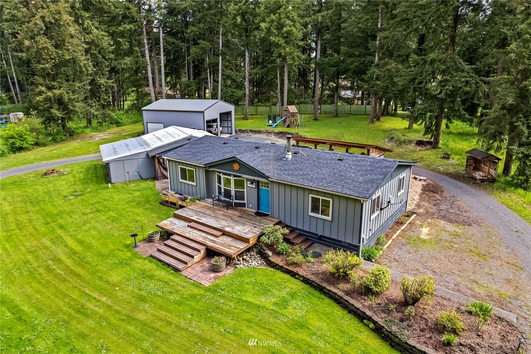 16820 Littlerock Road Southwest Rochester, WA 98579 - Photo 2 of 33 a view of a house with a big yard and sitting area