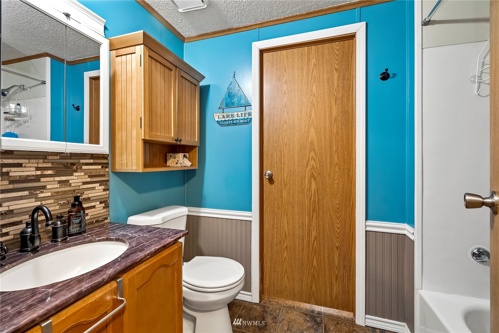 16820 Littlerock Road Southwest Rochester, WA 98579 - Photo 30 of 33 a bathroom with a granite countertop sink toilet and shower