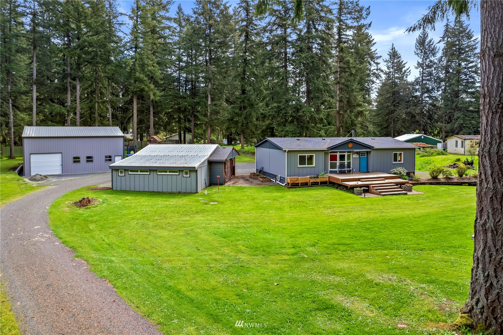16820 Littlerock Road Southwest Rochester, WA 98579 - Photo 4 of 33 a aerial view of a house with a big yard and large trees
