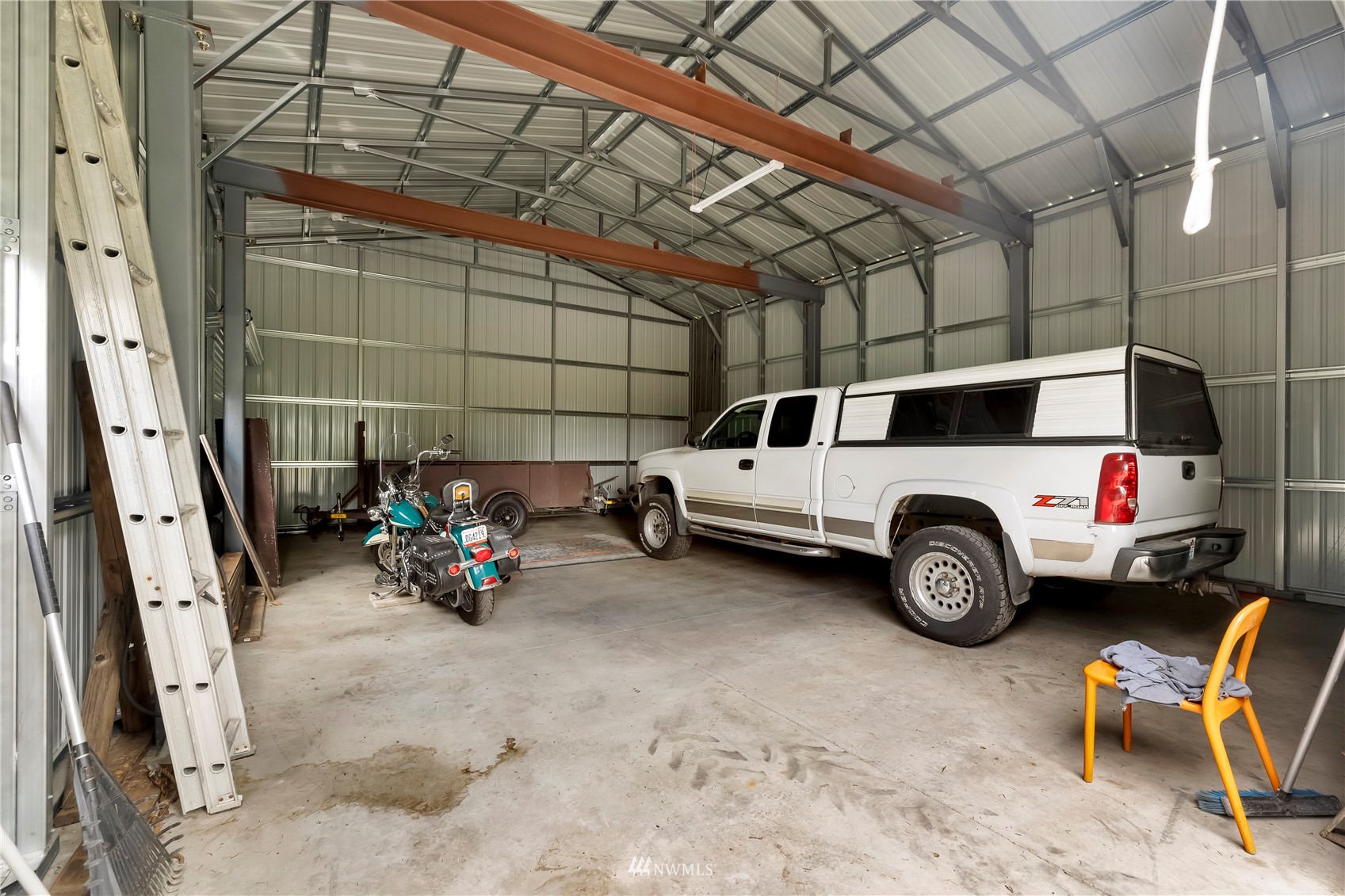 16820 Littlerock Road Southwest Rochester, WA 98579 - Photo 10 of 33 a view of a garage with parked cars