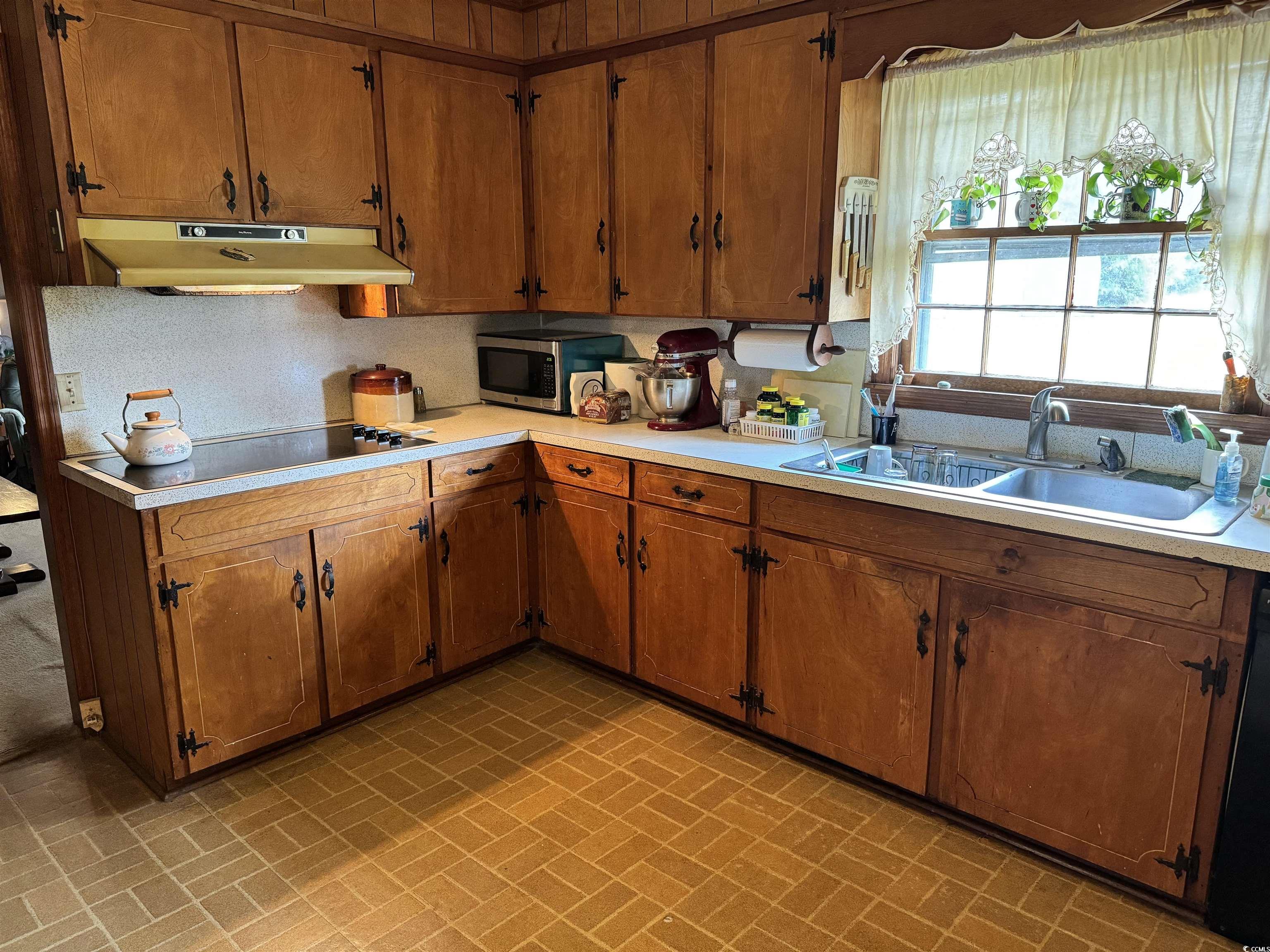 347 Harpers Road Marion, SC 29571 - Photo 3 of 35 Kitchen featuring dishwasher, tasteful backsplash, and sink