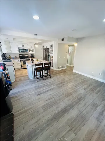 a view of a dining room with furniture and window