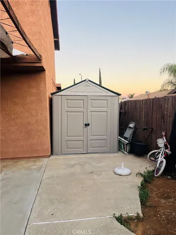 a front view of a house with parking area