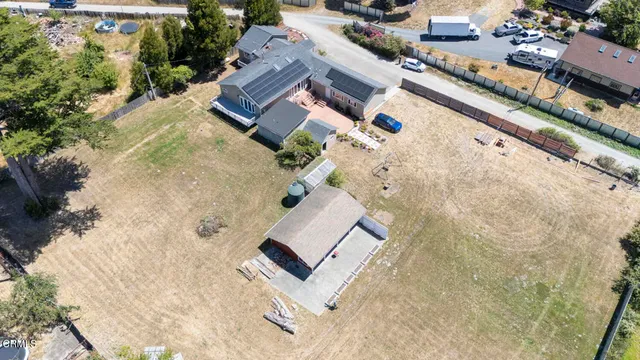 an aerial view of a house with swimming pool