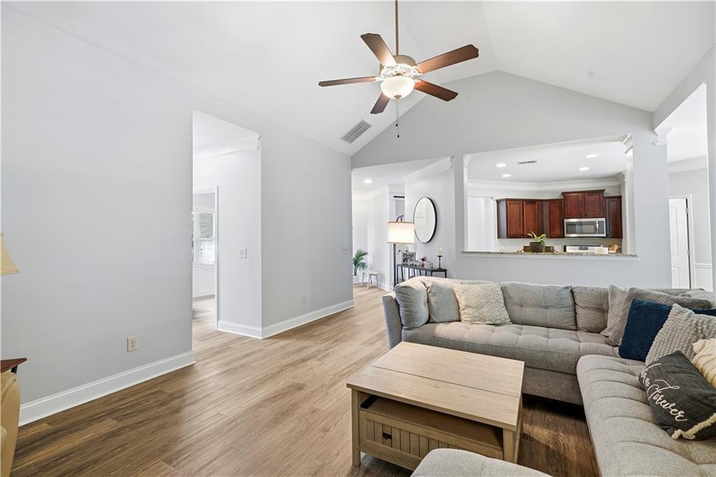 302 Spence Circle Ball Ground, GA 30107 - Photo 10 of 55 a living room with furniture and a wooden floor