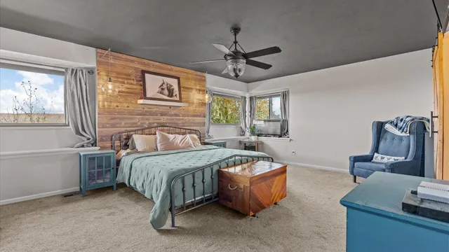 a bedroom with a bed and a couch