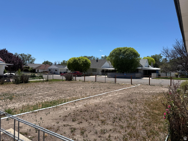 196 North 5th West Price, UT 84501 - Photo 22 of 27 Expansive undeveloped lot featuring clear land and defined property lines, bordered by a wire fence