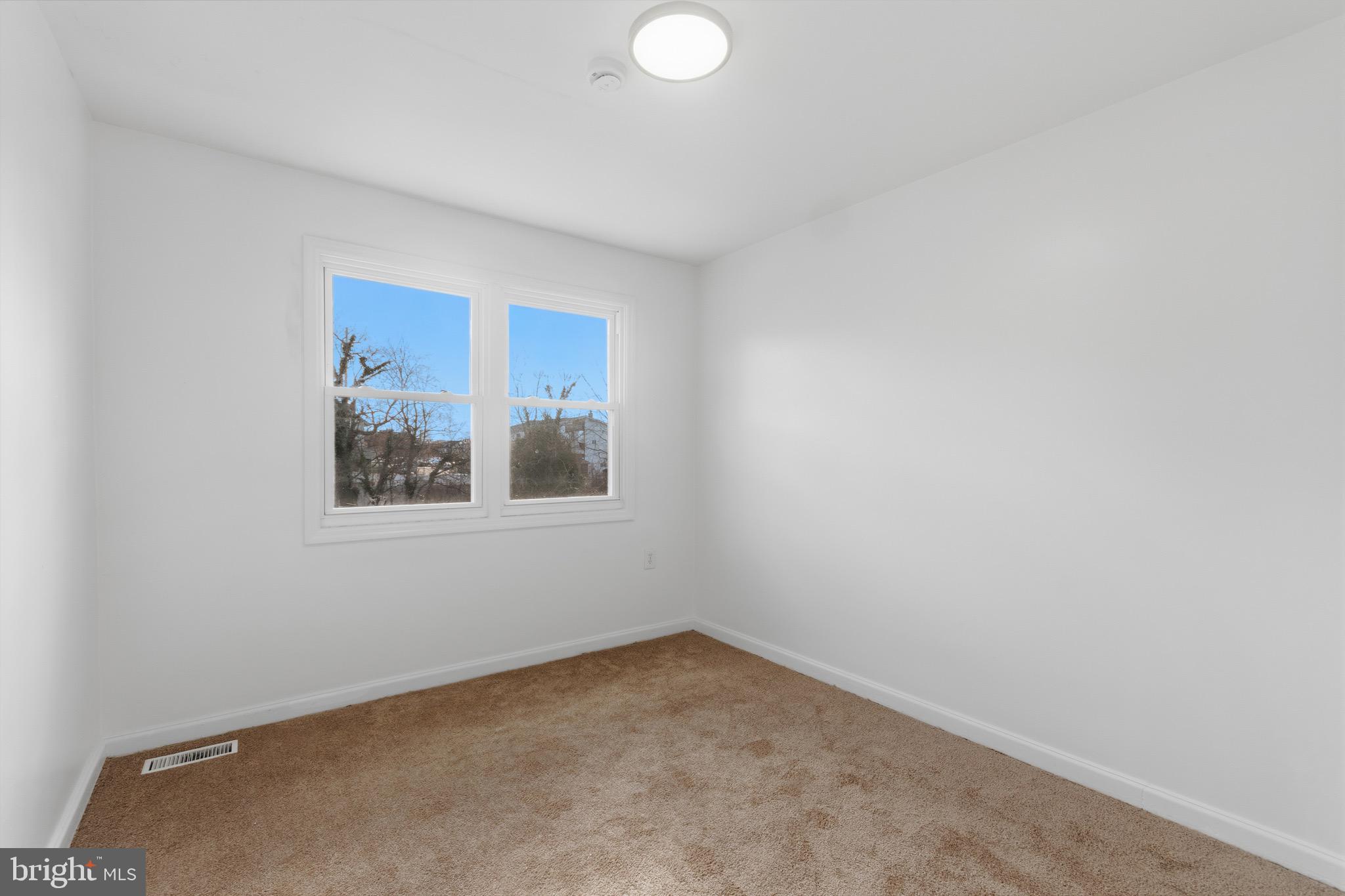 129 Brown Street Mount Holly, NJ 08060 - Photo 11 of 19 a view of an empty room with a window