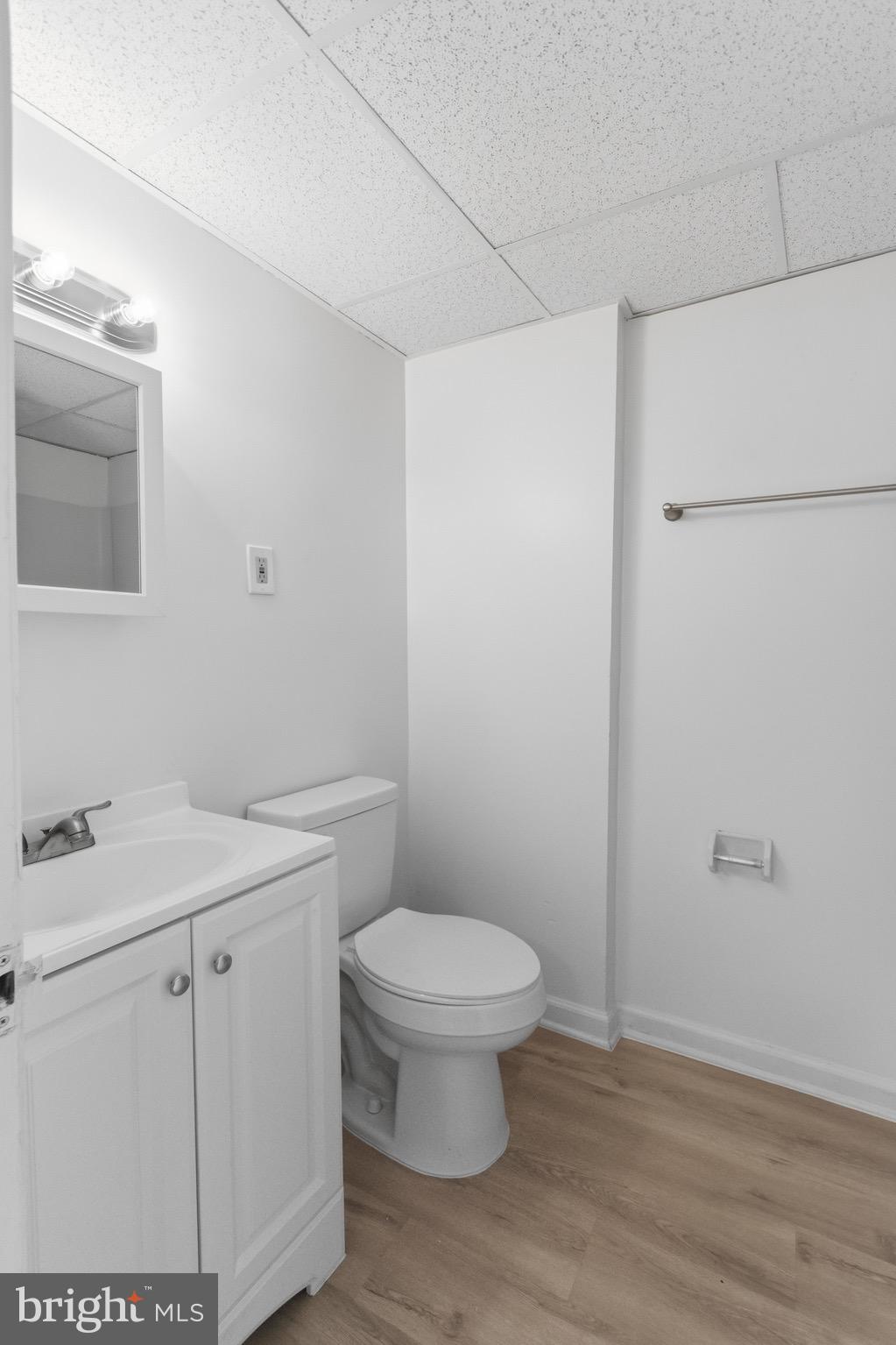 129 Brown Street Mount Holly, NJ 08060 - Photo 13 of 19 a bathroom with a sink a toilet and a light fixture