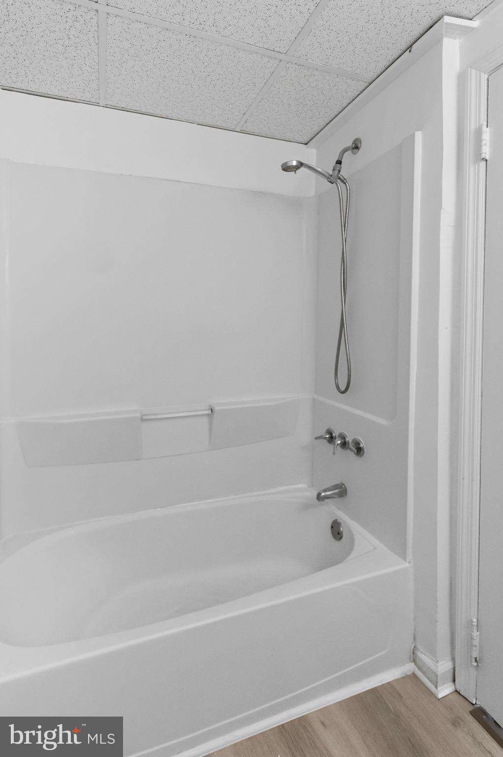 129 Brown Street Mount Holly, NJ 08060 - Photo 14 of 19 a bathroom with a shower and a bath tub