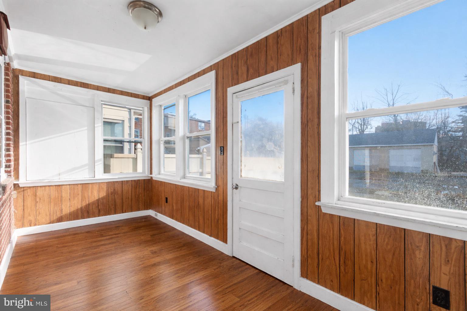 129 Brown Street Mount Holly, NJ 08060 - Photo 17 of 19 an empty room with wooden floor and windows