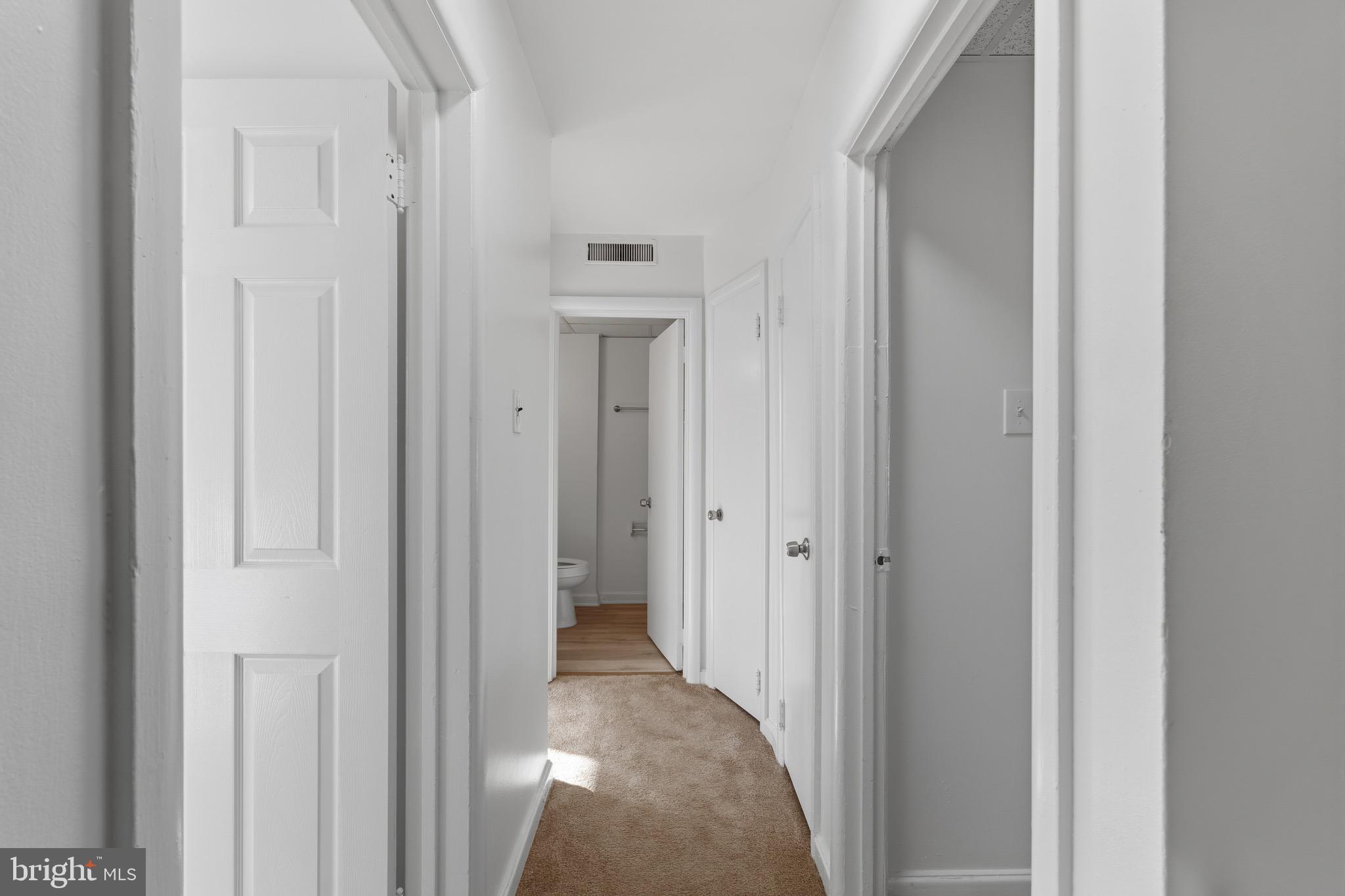 129 Brown Street Mount Holly, NJ 08060 - Photo 8 of 19 a view of a hallway with a wooden door
