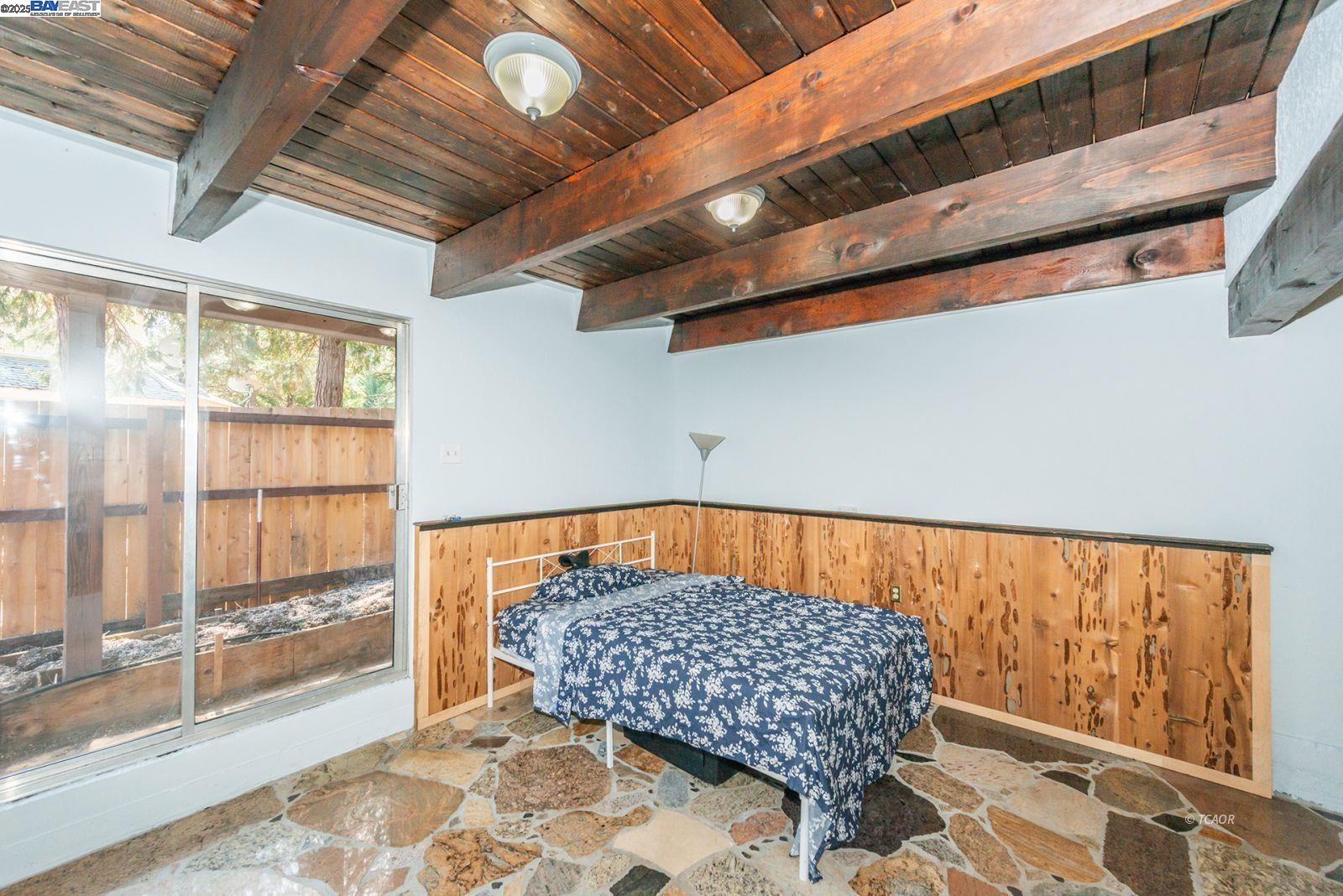 230 Mary Avenue Trinity Center, CA 96091 - Photo 18 of 46 a bed sitting in a room next to a window