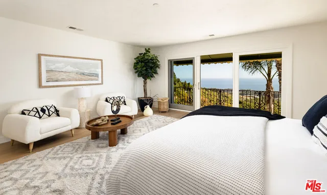 a bedroom with a bed and a couch