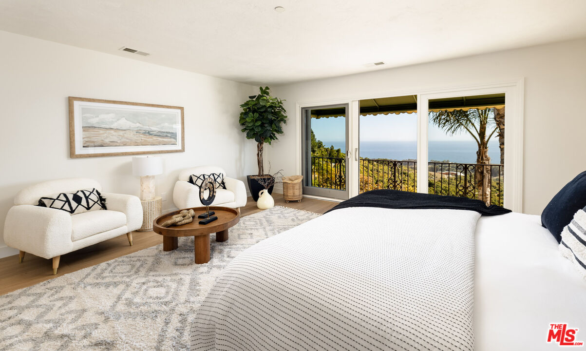 10890 Highway 101 Goleta, CA 93117 - Photo 17 of 29 a bedroom with a bed and a couch