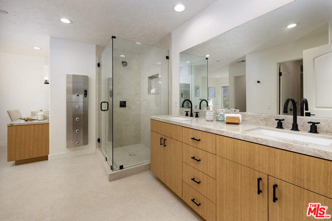 10890 Highway 101 Goleta, CA 93117 - Photo 18 of 29 a bathroom with double sink shower and two mirror