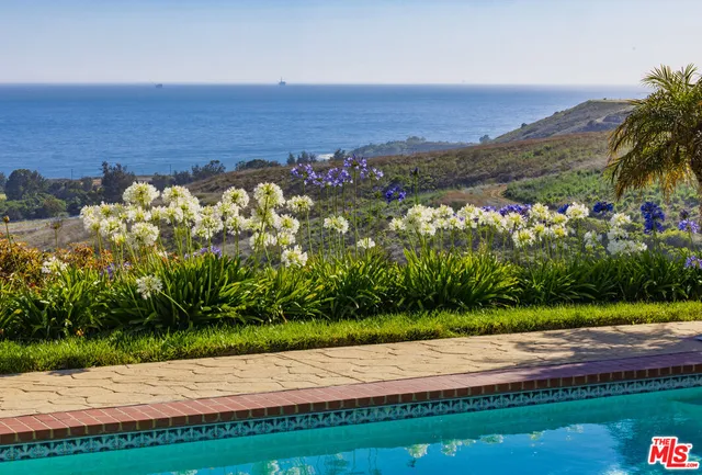 a view of a pathway with a lake view