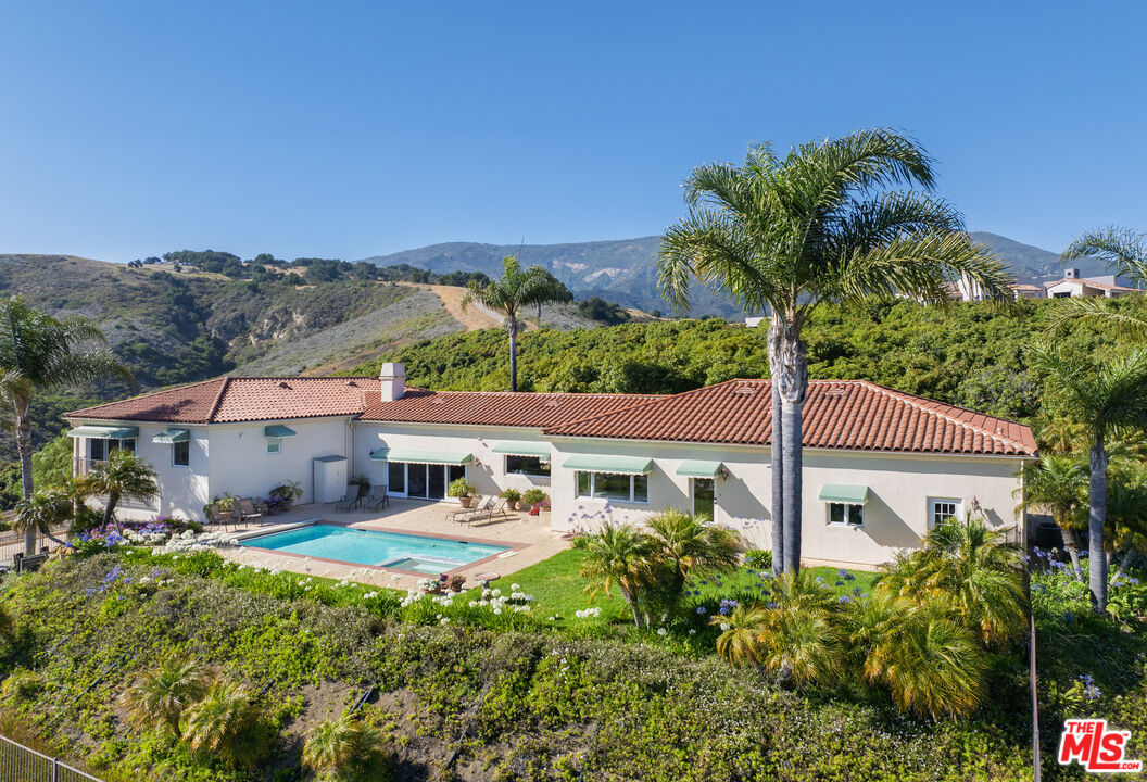 10890 Highway 101 Goleta, CA 93117 - Photo 2 of 29 a front view of a house with a yard and potted plants