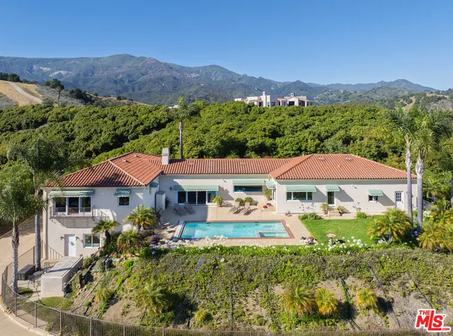 an aerial view of a house with a garden