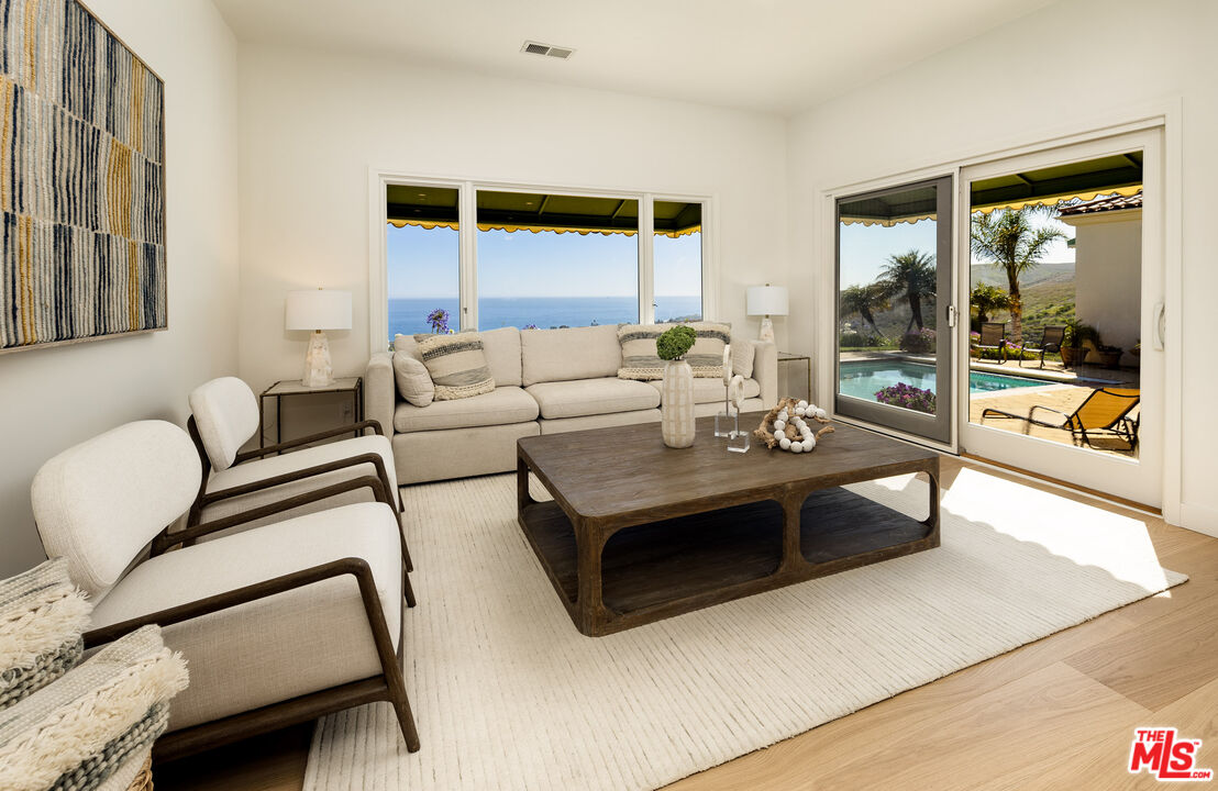 10890 Highway 101 Goleta, CA 93117 - Photo 8 of 29 a living room with furniture and a large window