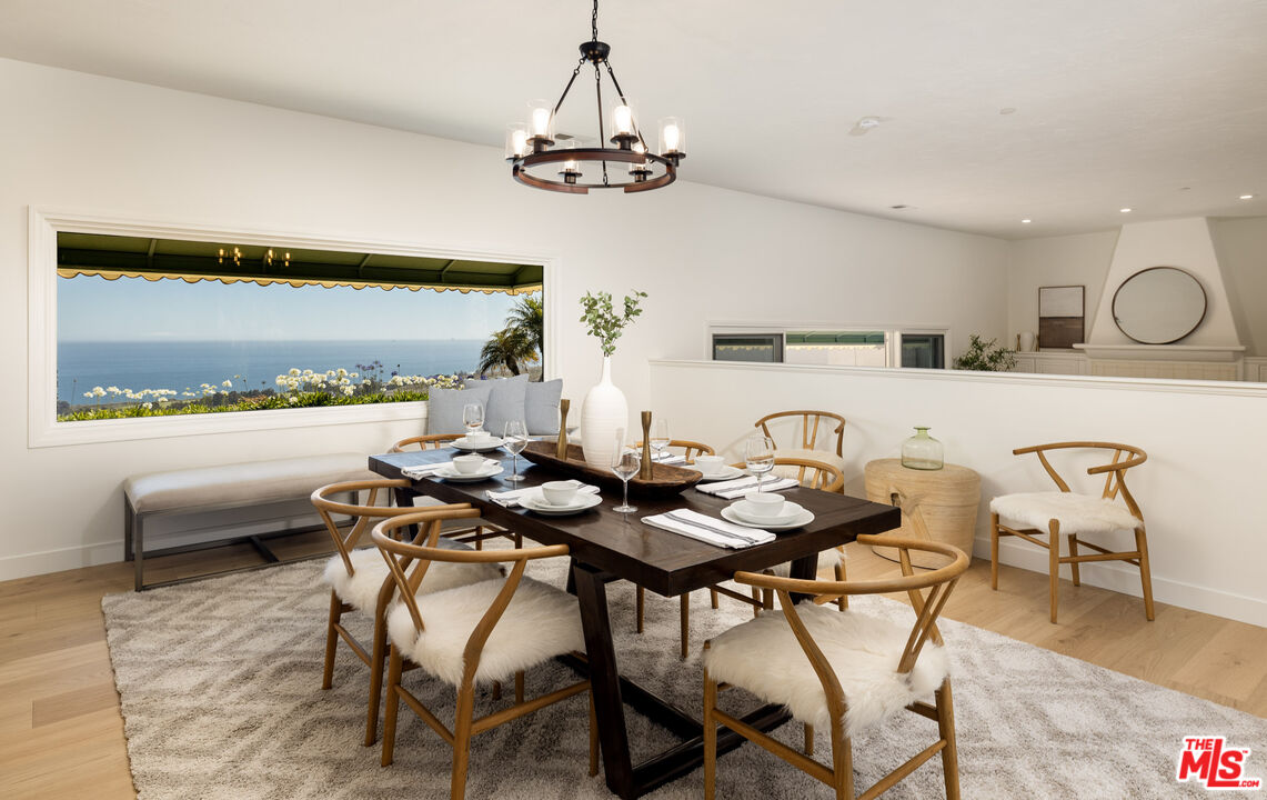 10890 Highway 101 Goleta, CA 93117 - Photo 9 of 29 a dining room with furniture and a chandelier