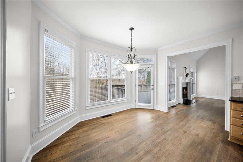 8805 Saddle Trail Ball Ground, GA 30107 - Photo 18 of 53 a view of a room with wooden floor chandeliers and kitchen