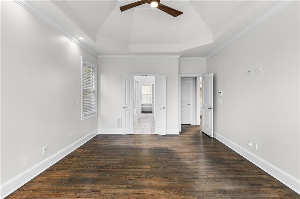 8805 Saddle Trail Ball Ground, GA 30107 - Photo 30 of 53 a view of an empty room with wooden floor