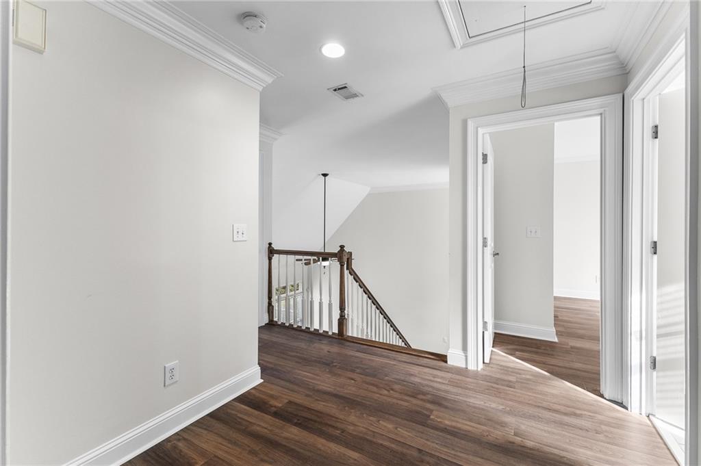 8805 Saddle Trail Ball Ground, GA 30107 - Photo 36 of 53 a view of entryway and hall with wooden floor