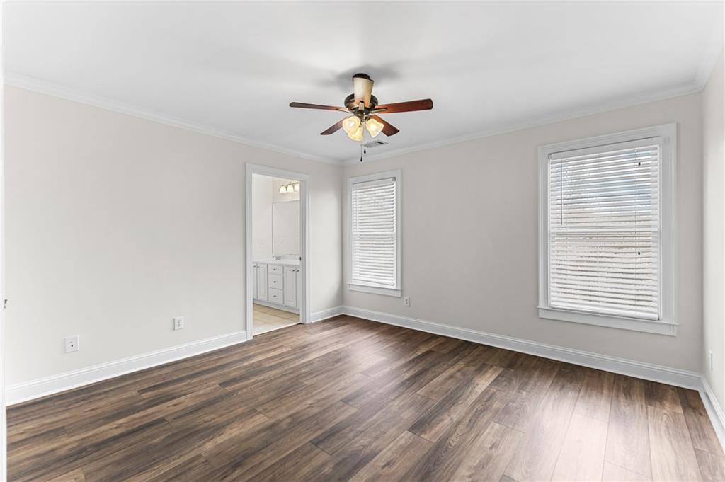 8805 Saddle Trail Ball Ground, GA 30107 - Photo 37 of 53 wooden floor in an empty room with a window