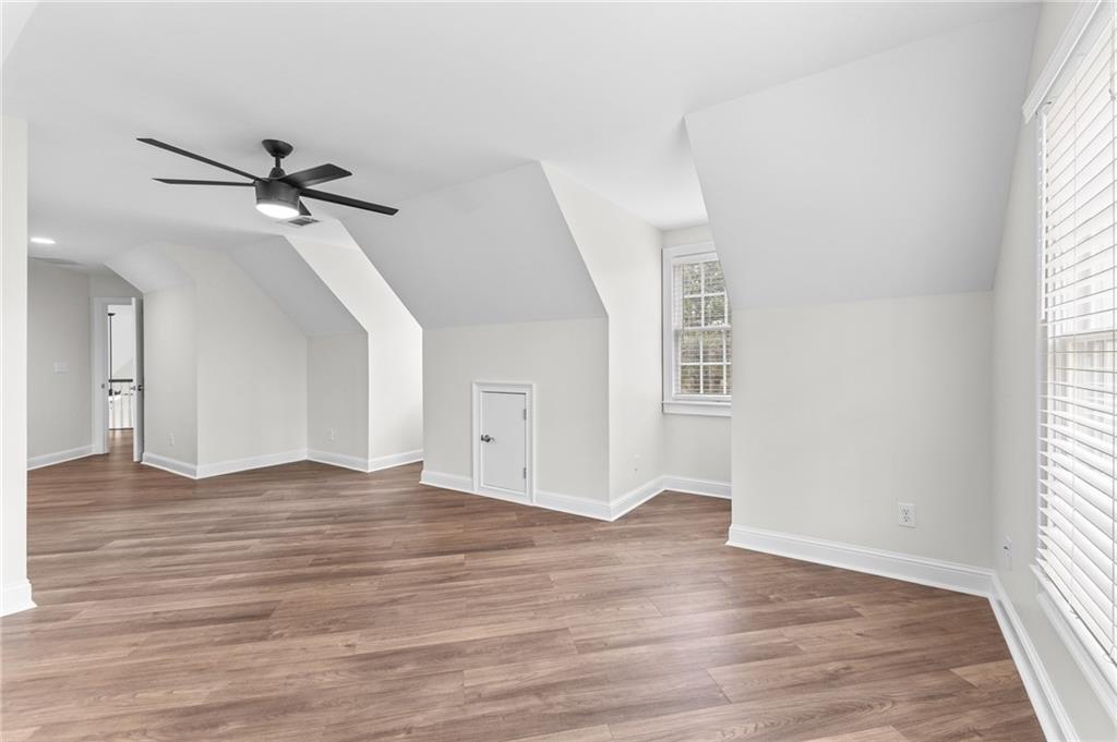 8805 Saddle Trail Ball Ground, GA 30107 - Photo 44 of 53 wooden floor in an empty room with a window
