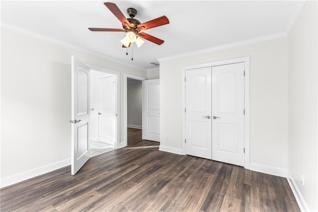 8805 Saddle Trail Ball Ground, GA 30107 - Photo 47 of 53 a view of a livingroom with wooden floor