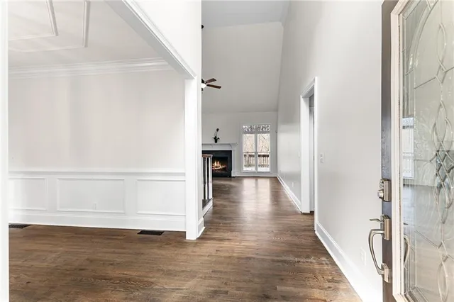 a view of an entryway with wooden floor