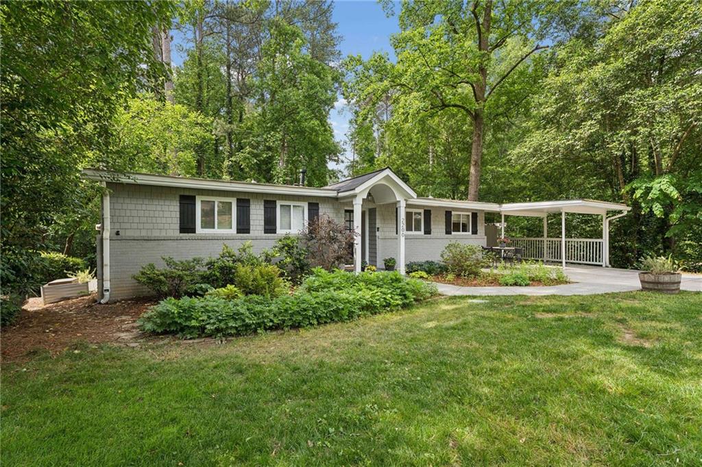 2200 Drew Valley Road Northeast Atlanta, GA 30319 - Photo 1 of 39 front view of a house with a yard