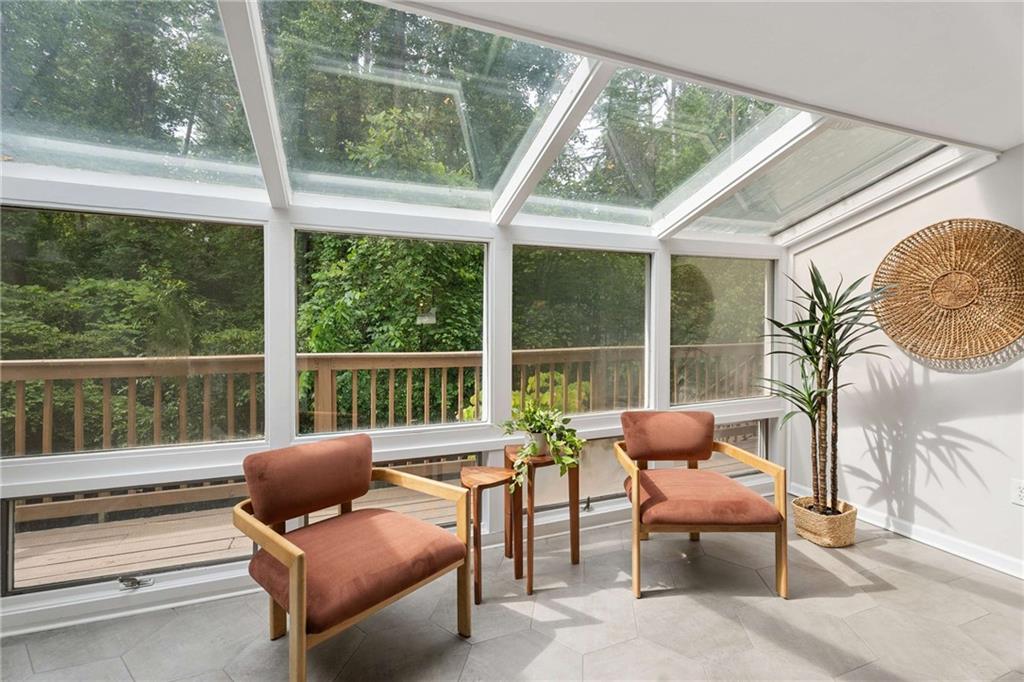 2200 Drew Valley Road Northeast Atlanta, GA 30319 - Photo 11 of 39 a balcony with furniture and wooden floor