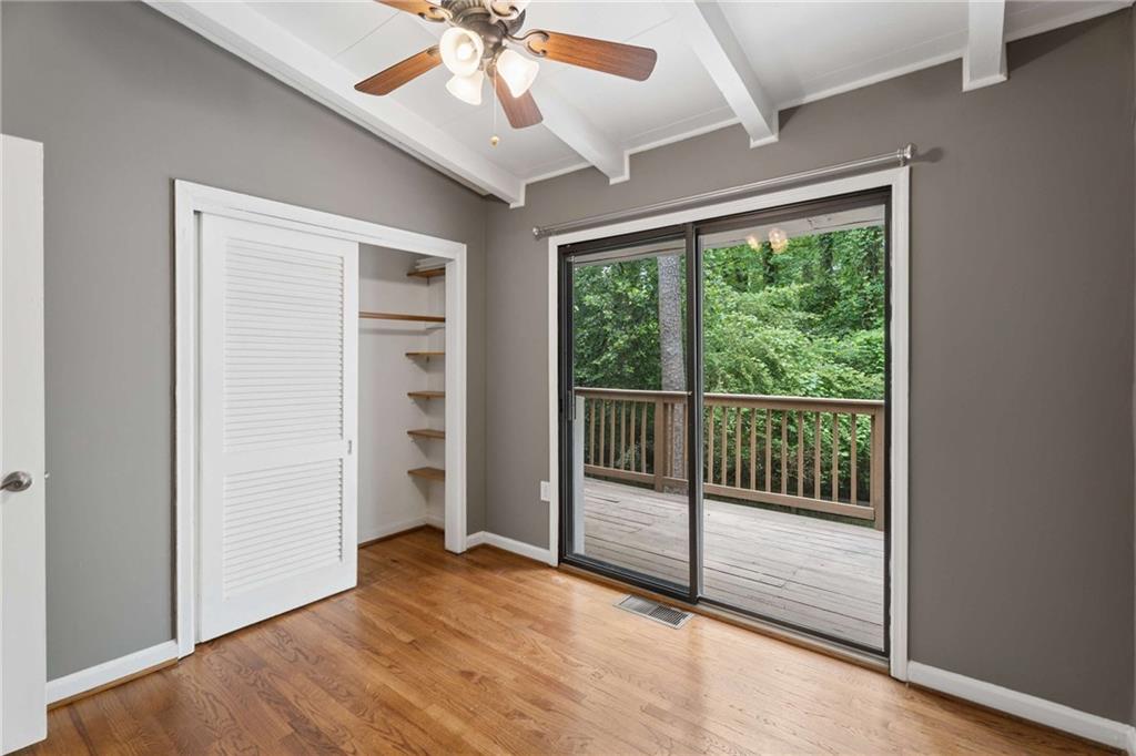 2200 Drew Valley Road Northeast Atlanta, GA 30319 - Photo 17 of 39 a view of empty room with wooden floor and fan