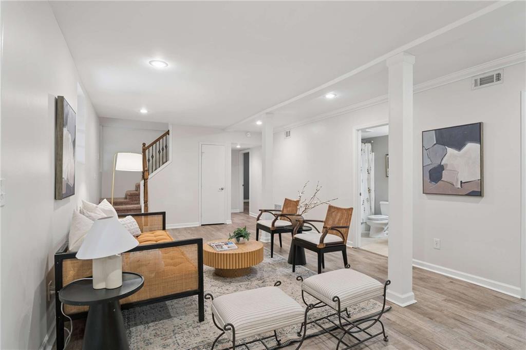 2200 Drew Valley Road Northeast Atlanta, GA 30319 - Photo 20 of 39 a living room with furniture and a wooden floor
