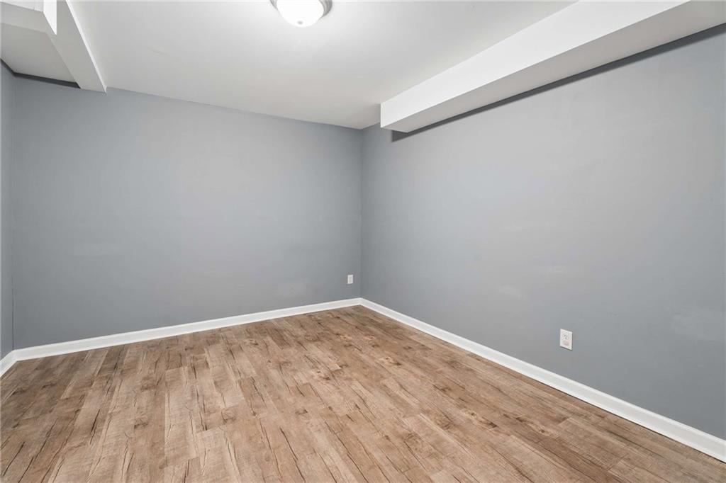 2200 Drew Valley Road Northeast Atlanta, GA 30319 - Photo 22 of 39 a view of an empty room with wooden floor