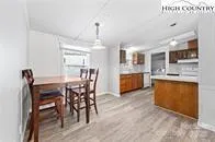 a view of kitchen with cabinets and wooden floor