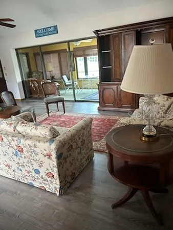 a living room with furniture and a lamp