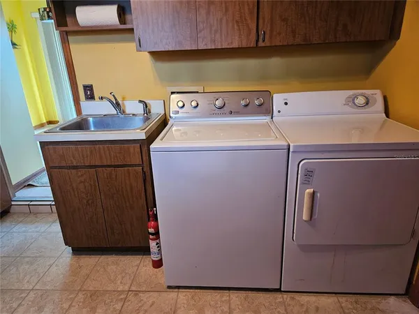 a utility room with dryer and washer